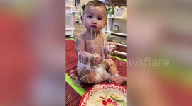 Oops! Messy baby left covered in noodles while eating lunch at home in South Korea