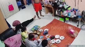 Surprise and hilarity as dog accidentally hurls family's dinner across the room when leash catches on mat
