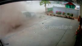Factory worker cheats death as out-of-control pickup truck flips over and lands where she was sitting