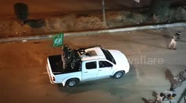 A military parade for members of the Al-Qassam Brigades roaming the streets of Jabalia camp in the northern Gaza Strip.