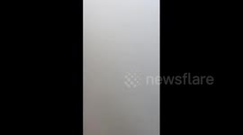 Residents in apartments unable to see the ground as dense fog shrouds northern India