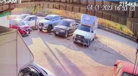 Truck hits pothole and spins out of control into row of parked cars