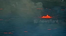 Hawaii's Kilauea volcano spews red-hot lava