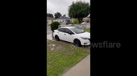 Streets are partly flooded after heavy rain in Los Angeles, CA, USA