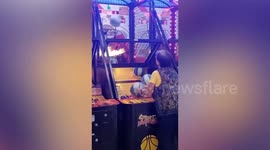 Gandmother scores more than 200 hoops at basketball arcade game in the Philippines