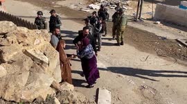Palestinian woman cries as buildings are demolished by Israeli forces in Hebron