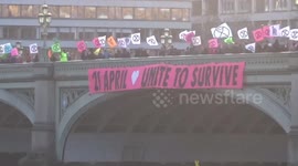 Extinction Rebellion display banner in London asking 100,000 people to blockade Parliament