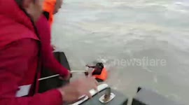 Police brave storm to save five fishermen stranded in sea in Thailand