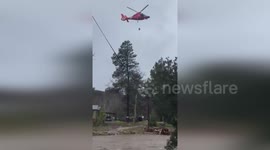 Dog and couple rescued as floodwaters rise in Arroyo Seco, US