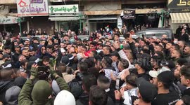 Palestinian mourners carry the body of Ahmed Abu Junaid, who succumbed to his wounds after he was shot earlier during clashes