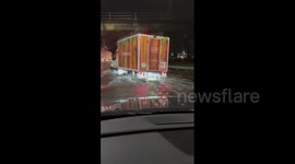 Vehicles struggle through submerged roads as Wales battered by rain