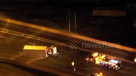 The Little Truck that could NOT I95 North bound late night random truck laying on its side on bridge illuminated in light.