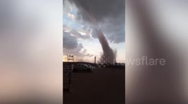Phenomenal landspout tornado towers over hills in Saudi Arabia