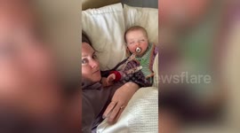 Adorable video shows a clingy baby who refuses to let her mom leave bed