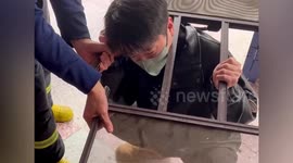 Chinese firefighters free man's head trapped in window frame