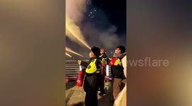 Officers spray extinguishers on Chinese man who illegally set off firework