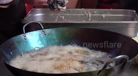 Restaurants Fry Meatballs At A Temple Fair in Yichang, China