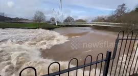 England's River Exe bursts its banks after torrential rain hits UK