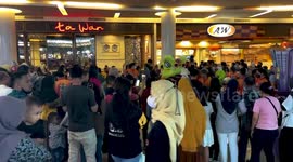 The barongsai (lion dance) is doing performance in Mall Trans of Makassar
