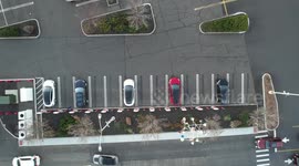 TESLA QUIET. A Simple Charging Solution quietly refueling its fleet as noisy cars pass by.