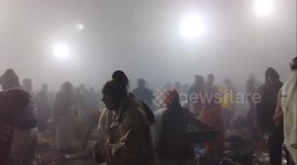 Hindu devotees take dip in sacred Sangam, India, where three rivers join together