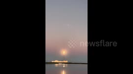 Onlookers cheer as they watch SpaceX's Falcon Heavy rocket launch in Florida, US