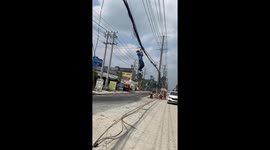 This Vietnamese electrician is being compared to Spider-Man as he dangle from wires