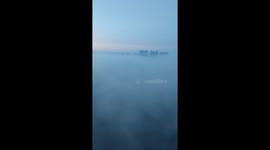 Chinese resident surprised by thick fog shrouding city