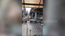 Train stops to give way to drivers blocking railway during traffic jam in Thailand