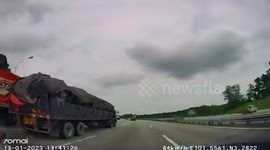 Steel pole flies from truck and pierces through driver's windshield in Malaysia