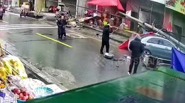 Out-of-control car narrowly misses pedestrians after smashing into stalls on Chinese roadside
