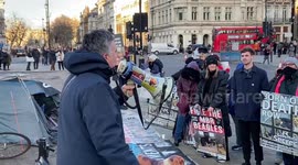 Animal rights campaigner and conservationist Dominic Dyer speaks at an animal testing protest outside parliament