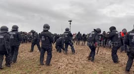 Activists throw mud at the police in Lützerath, Germany