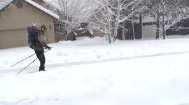 Arizona man hilariously skis down snow-covered road in Arizona