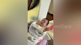 Chinese baby makes ‘OK’ hand sign after being fed