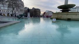 Trafalgar Square fountains freeze over as London temperatures plummet