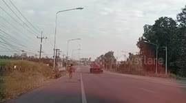 Naked man walking along road shocks drivers in Thailand
