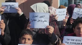 Palestinian women and children take part in a rally to demand of the reunification with their husbands and children in the West Bank