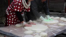 Residents make rice cakes to welcome incoming Chinese New Year