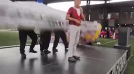 Lucky escape: Dramatic moment stage display collapses during school speech