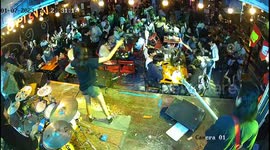 Singer falls from chair on stage while performing at bar