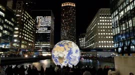 Visitors enjoy the dazzling Canary Wharf Winter Lights Festival on opening night in London