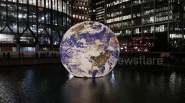 Earth seen floating around in waters of Canary Wharf during Winter Lights