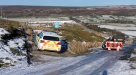 Icy North Yorkshire road blocked by overturned car