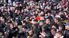 Mourners carry the bodies of Jawad Farid Bawaqna and Adham Mohammed Bassem Jabareen, during their funeral in the West Bank city of Jenin