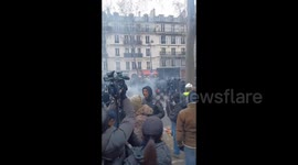 Smoke-filled scenes as police clash with protesters against pension reform in Paris, France