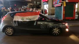 Iraqis celebrate their big football win by driving around London honking their car horns and waving flags