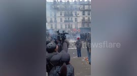 Crowds clash with riot police at pension reform protests in France