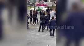 Locals wear matching green masks after attending business conference in Thailand