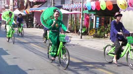 Thai beauty festival sees contestants ride around village on bicycles